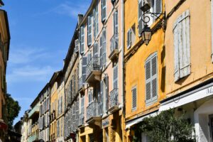 Charming street in Aix-en-Provence, Provence, with historic architecture, local cafés, and classic French old town atmosphere.