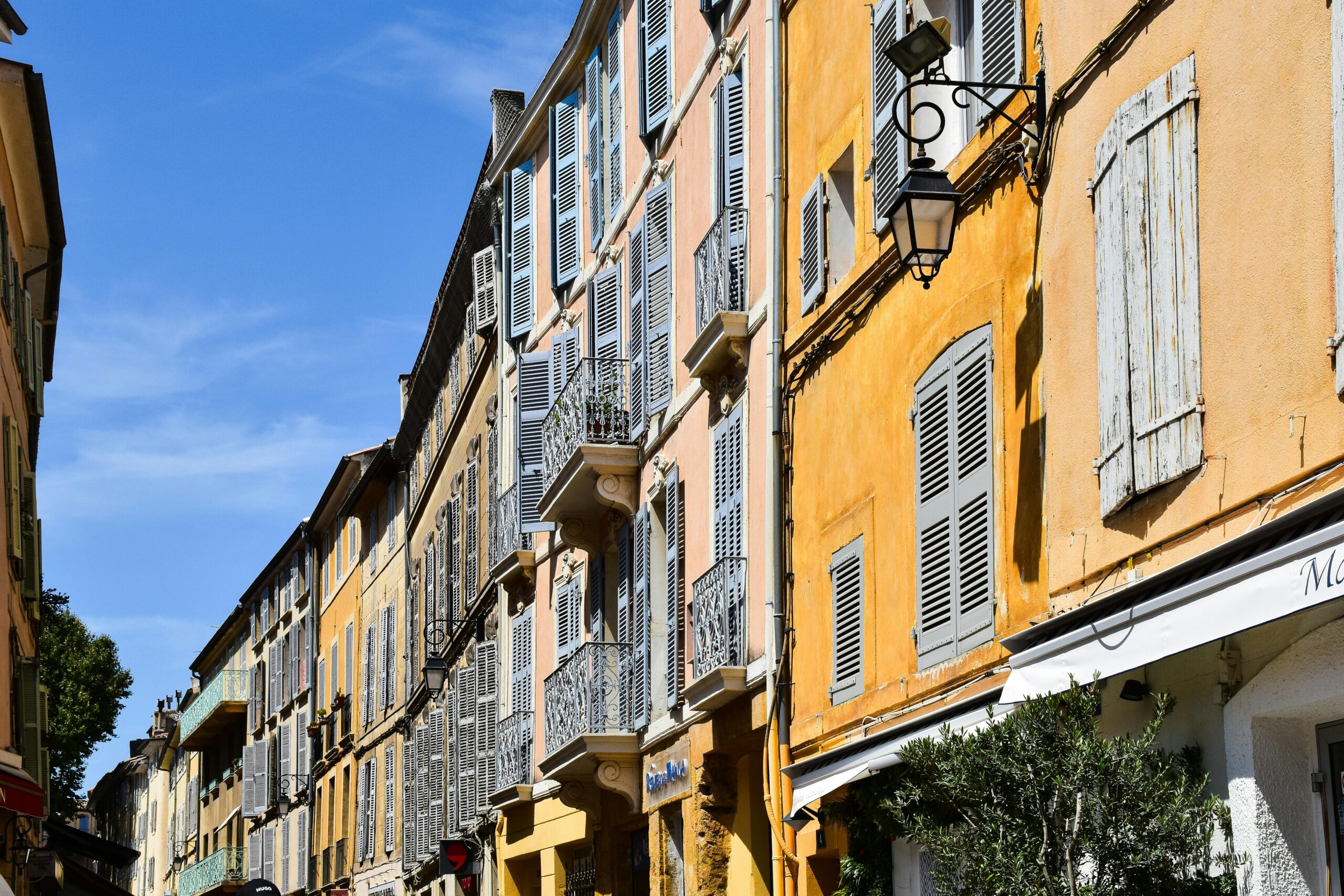 Charming street in Aix-en-Provence, Provence, with historic architecture, local cafés, and classic French old town atmosphere.