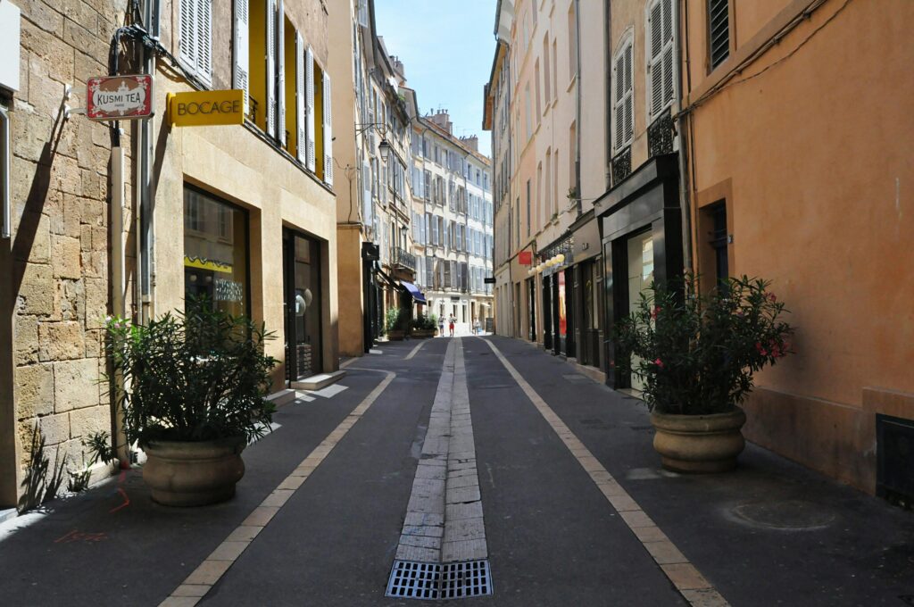 Charming street in Aix-en-Provence, Provence, with historic architecture, local cafés, and classic French old town atmosphere.
