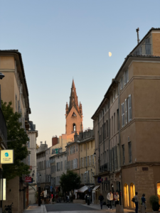 Historic street in Aix-en-Provence glowing in the golden sunset light, showcasing the charm and hidden gems of Provence.